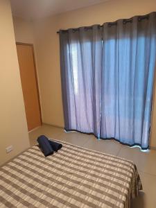 Postel nebo postele na pokoji v ubytování Edícula das torres