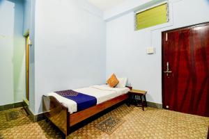 Hotel O NANDINI客房内的一张或多张床位