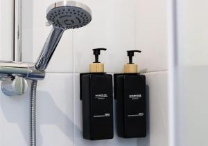 a couple of black soap dispensers in a bathroom at Dimore Al Borgo in Montagnana