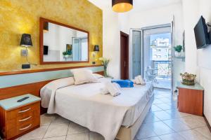 Postel nebo postele na pokoji v ubytování Hotel Vienna
