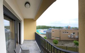 a balcony with a view of a water park at Apartmani Central A11 & Free parking in Vrnjci