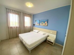 Postel nebo postele na pokoji v ubytování Villaggio A Mare