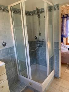 a shower with a glass door in a bathroom at Lovely family house in the middle of nature in Saint-Marcel-du-Périgord +29 photos