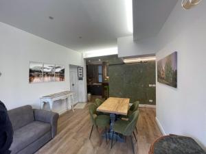 a living room with a couch and a table at GiuByLeo in Rome