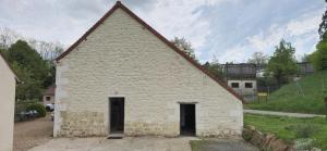 an old stone church with a triangular roof at Gîte Caves de Beauval (à 100m du zooparc !) in Saint-Aignan