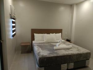 Postel nebo postele na pokoji v ubytování Citi Hotel Uno
