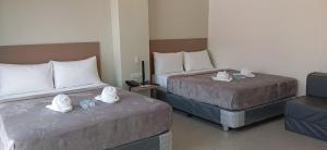 Postel nebo postele na pokoji v ubytování Citi Hotel Uno