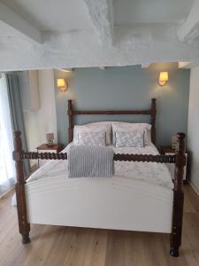 a bedroom with a large bed with white sheets and pillows at Maison Belle Vue in Cherval +15 photos