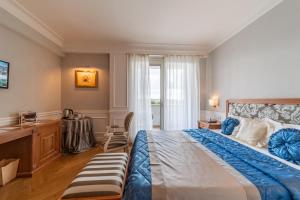 Postel nebo postele na pokoji v ubytování Tesoretto Hotel