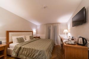 Letto o letti in una camera di Tesoretto Hotel