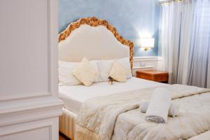 Letto o letti in una camera di Tesoretto Hotel