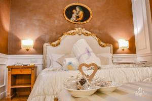 Letto o letti in una camera di Tesoretto Hotel