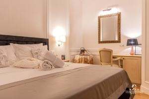 Letto o letti in una camera di Tesoretto Hotel