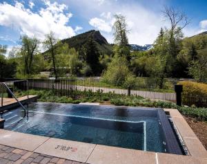 a swimming pool in the backyard of a house at Westin Resort 721 in Avon