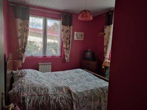 a bedroom with a bed and a window at Mimi in Quend