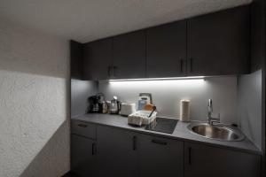a kitchen with a sink and a counter top at Studio Nonntal in Salzburg