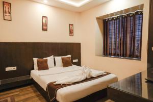 Postel nebo postele na pokoji v ubytování Hotel Sheldon International Near Science City + 24 fotografií