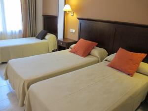 Cama o camas de una habitación en Hotel Turmo