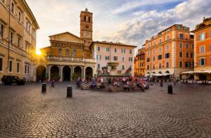 a city square with a clock tower and a building at CASA PANIERI in Rome