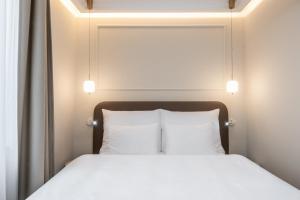 Postel nebo postele na pokoji v ubytování Mamma´s Boutique Hotel