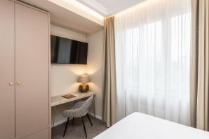 Postel nebo postele na pokoji v ubytování Mamma´s Boutique Hotel