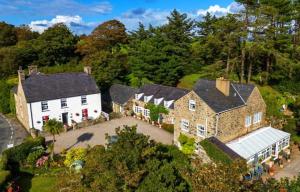 an aerial view of the house and its grounds at Yr Hen Felin - The Old Mill B&B in Morfa Nefyn
