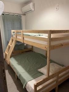 a couple of bunk beds in a room at G-House Skiathos in Skiathos