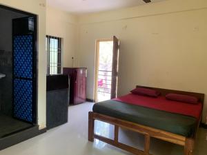 Voodi või voodid majutusasutuse Prakash holliday home toas