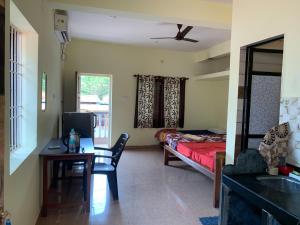 Voodi või voodid majutusasutuse Prakash holliday home toas