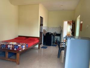 Voodi või voodid majutusasutuse Prakash holliday home toas
