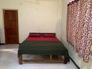 Voodi või voodid majutusasutuse Prakash holliday home toas
