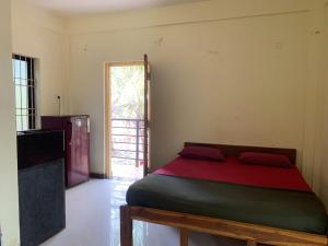 Voodi või voodid majutusasutuse Prakash holliday home toas