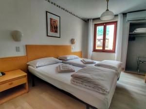 Postel nebo postele na pokoji v ubytování Hotel Modena old town