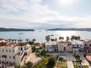 an aerial view of a city with boats in the water at A1 - Luxury house with pool by goutos properties in Porto Heli