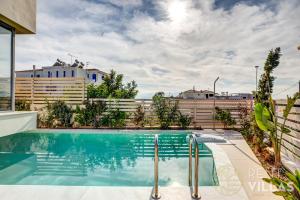 a swimming pool in the backyard of a house at A1 - Luxury house with pool by goutos properties in Porto Heli