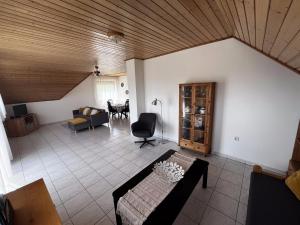 a living room with a couch and a table at Chill Apartman in Balatonfüred
