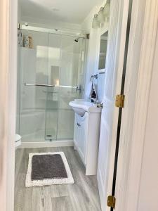 a bathroom with a shower and a sink at Holiday House in Bathurst