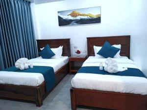 Una cama o camas en una habitación de Panda Guest House