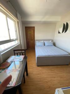 Ένα ή περισσότερα κρεβάτια σε δωμάτιο στο Smart Choice Condo Hotel +21 φωτογραφίες