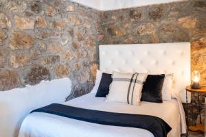 Postel nebo postele na pokoji v ubytování Apartamentos Rurales La Laguna Somiedo