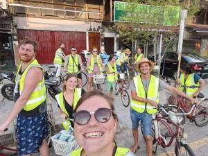 a group of people wearing yellow safety vests at Ringo's Foyer in Melaka