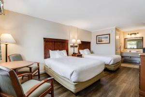 Postel nebo postele na pokoji v ubytování Oceanus Motel - Rehoboth Beach