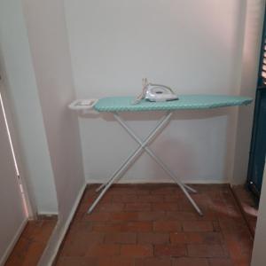 a table in a corner with a green counter top at Central Apartment with view, 2 bedrooms, living room, kitchen, 1 bathroom in Saint-Louis
