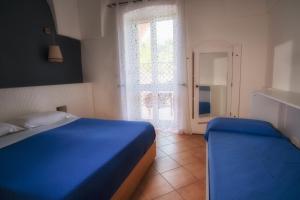 Posteľ alebo postele v izbe v ubytovaní B&B Happy Days Golfo di Gallipoli