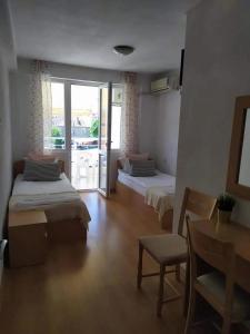 Ένα ή περισσότερα κρεβάτια σε δωμάτιο στο Guest house Pepina
