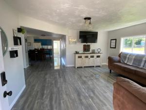 a living room with a couch and a table at Blue Mountain Retreat in Elgin