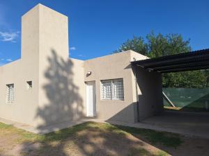 a large white building with a large garage at La Cañada in Juana Koslay 