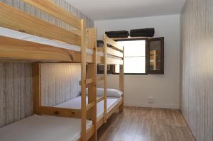 Postel nebo postele na pokoji v ubytování Albergue Gares