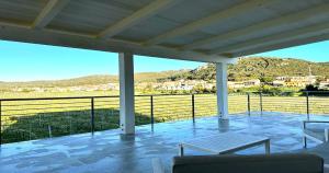 a screened porch with a view of a mountain at VivimiHome - Monti House in Monti