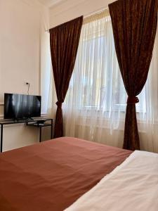 TV a/nebo společenská místnost v ubytování Umi B&B